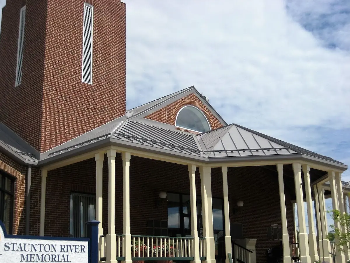 Skilled roofing craftsmen working on a residential roof in Meadows